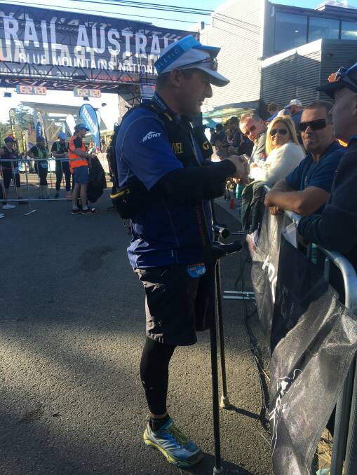 One-legged Winter Paralympian Michael Milton chats to fans after completing the UTA22.