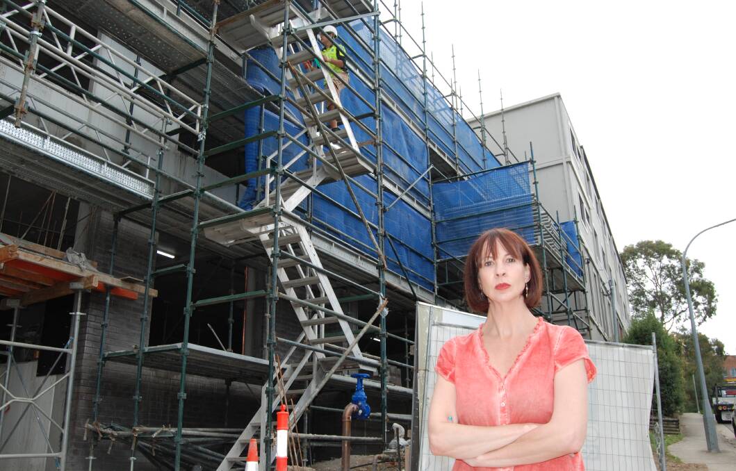 Stop this masterplan: Shae Foenander is trying to kill off “Penrith-style” development coming to Springwood. Pictured outside a four storey housing development in Springwood Ave which she said she “would never have voted for”.