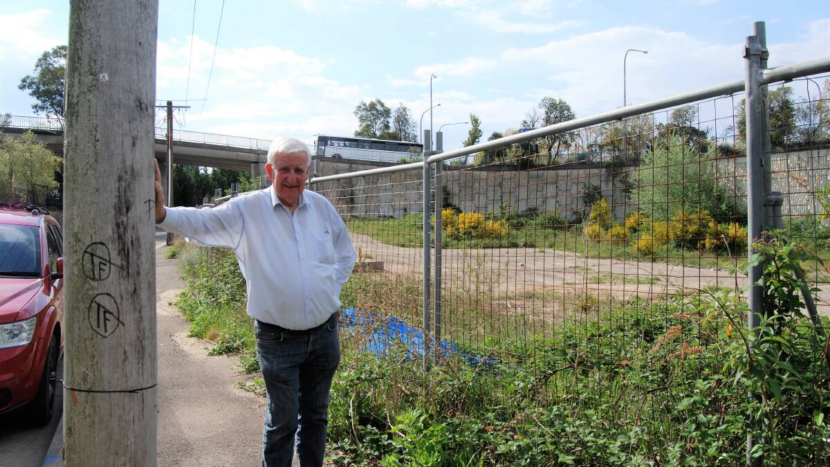 Zombie DA: Cr Kevin Schreiber beside the vacant site in Goldsmith Place, adjacent to Yeaman Bridge, which was approved for development in 2007.