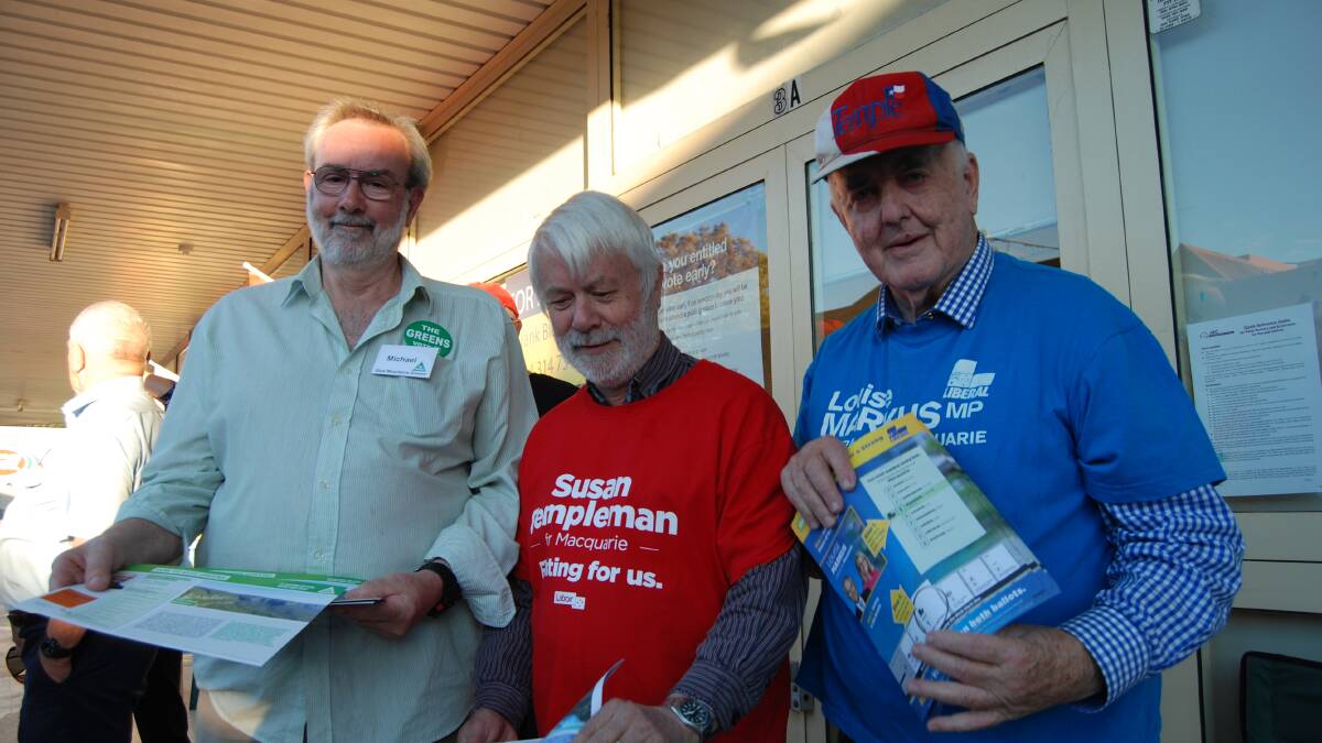 Pre-polling pitch: Michael Ord, Mick Fell and Alasdair Webster outside the Springwood voting booth which is open every day except Sunday until the election.