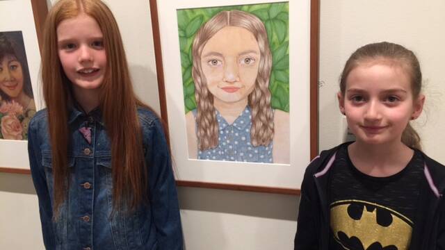 At the NSW Art Gallery: Excited to see her work, and her little sister's face up on the walls.