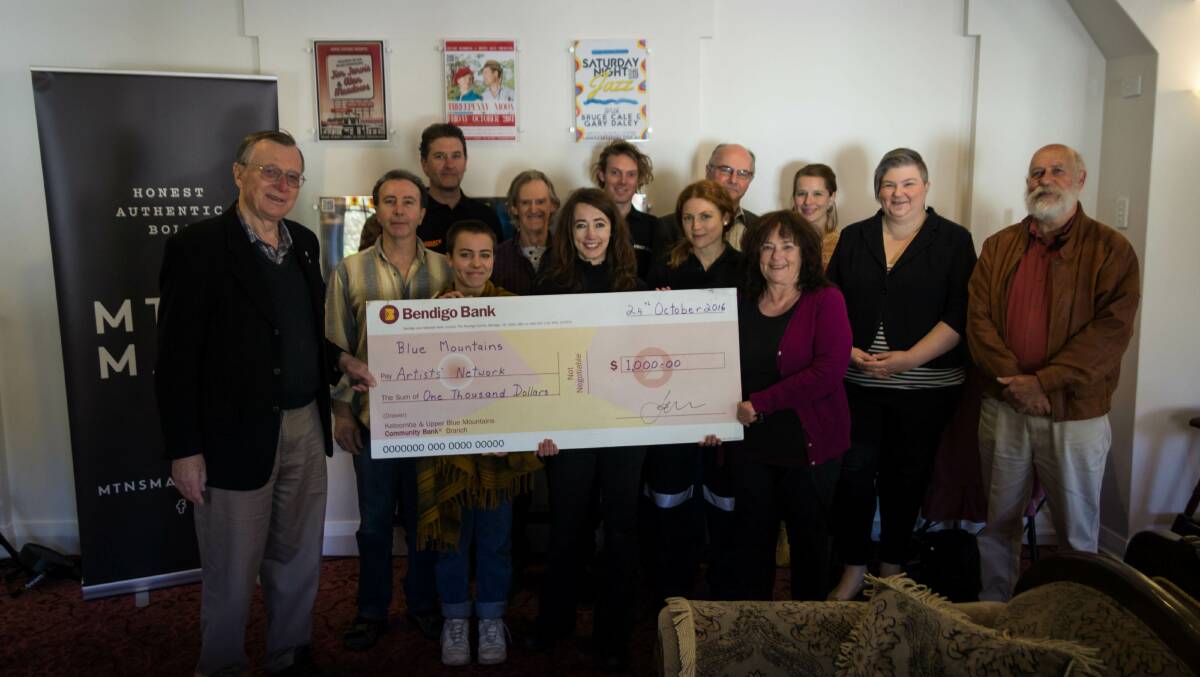 Community support: The Blue Mountains has got behind the film, The Last Babushka Doll, pictured centre with a production cheque is the author Georgina Luck.