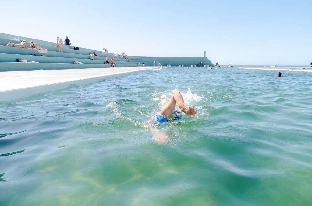 Kay Burton completes her lap of the new Newcastle Ocean Baths.