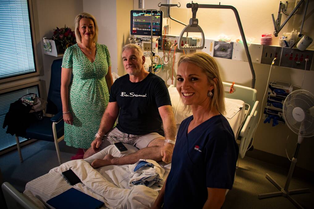 DOWN BUT NOT OUT: Newcastle Knights legend Tony Butterfield was saved when Colinda Holmes (left) and Rachael Paton (right) were able to keep him alive after he suffered a heart attack at No. 2 Sportsground on Saturday. Butterfield is now recovering at John Hunter Hospital.
