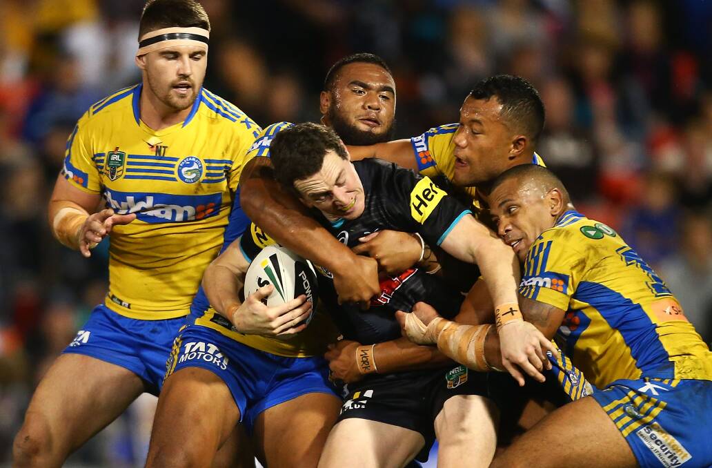 David Simmons of the Panthers is tackled during the round 12 NRL match between the Penrith Panthers and the Parramatta Eels at Sportingbet Stadium on May 30, 2014 in Sydney, Australia.  (Photo by Mark Nolan/Getty Images) 