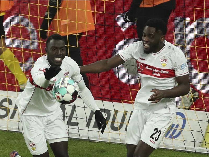 Stuttgart striker Silas Wamangituka (l) has revealed his name and birth date were changed.