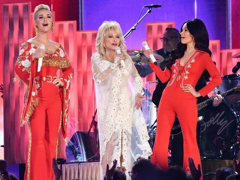 Katy Perry, Dolly Parton and Kacey Musgraves sing during a tribute to Parton at the Grammy awards.