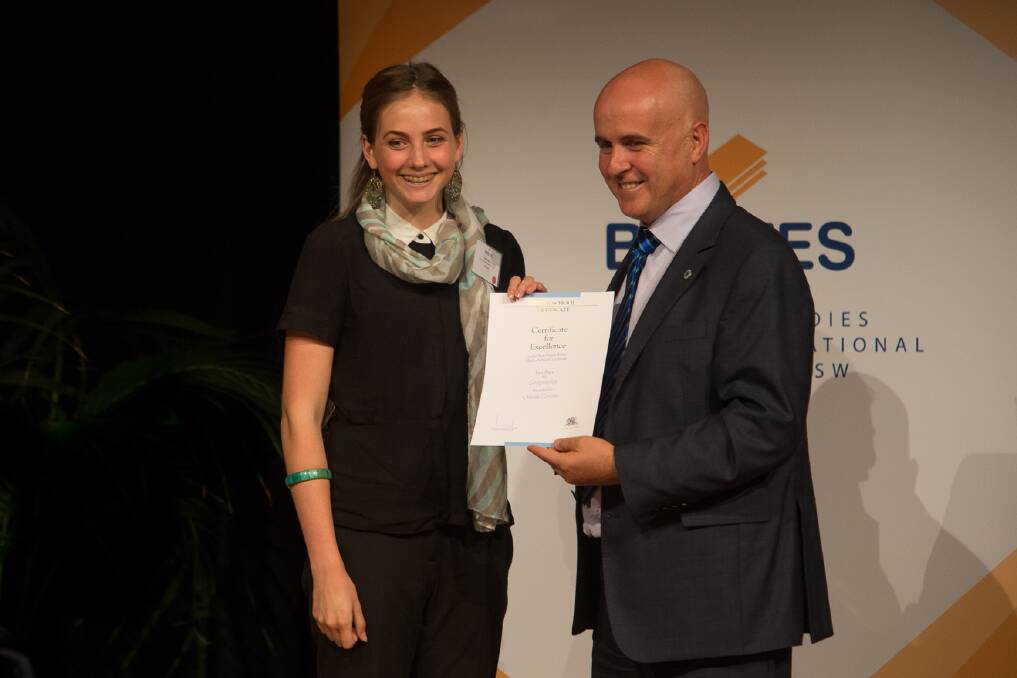 Good times: Olivia Grivas receives her award from Education Minister Adrian Piccoli. Picture: Geoff Jones
