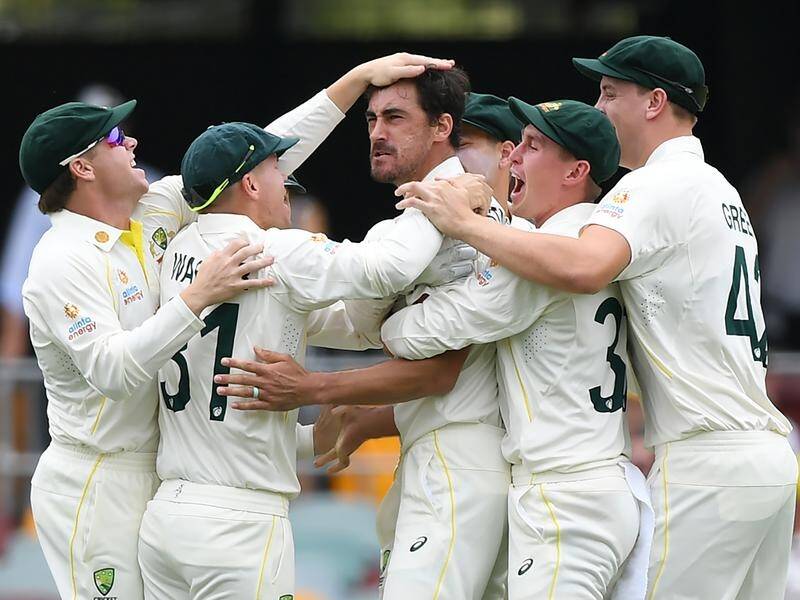 Mitchell Starc (c) set the tone for the day with a wicket off the first ball at the Gabba Test.
