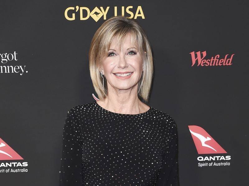 Olivia Newton-John, who is living with cancer, says she is determined to enjoy every day.
