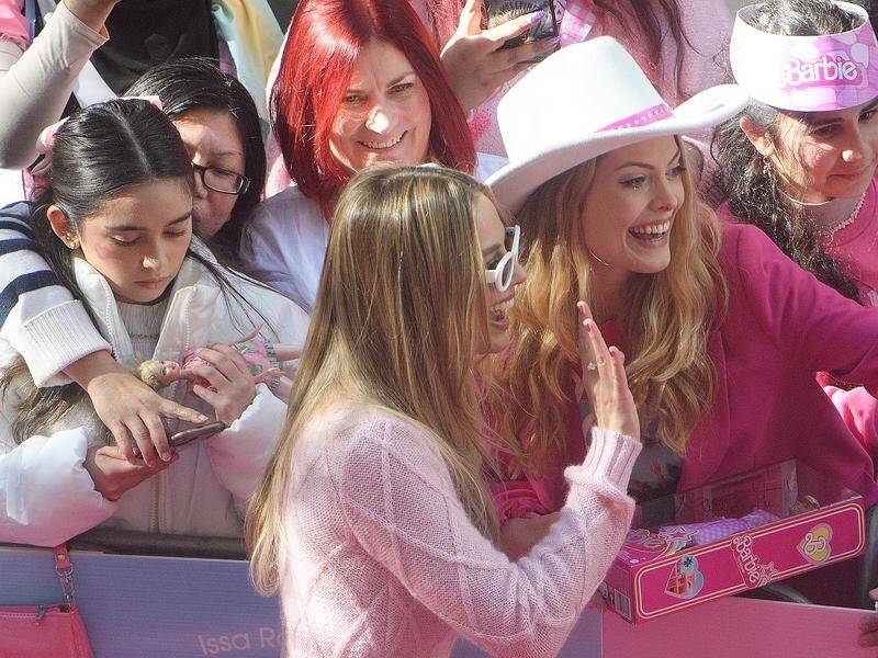 A flock of flamingo-pink fans surrounded Barbie star Margot Robbie in Sydney's Pitt Street mall. (Bianca De Marchi/AAP PHOTOS)