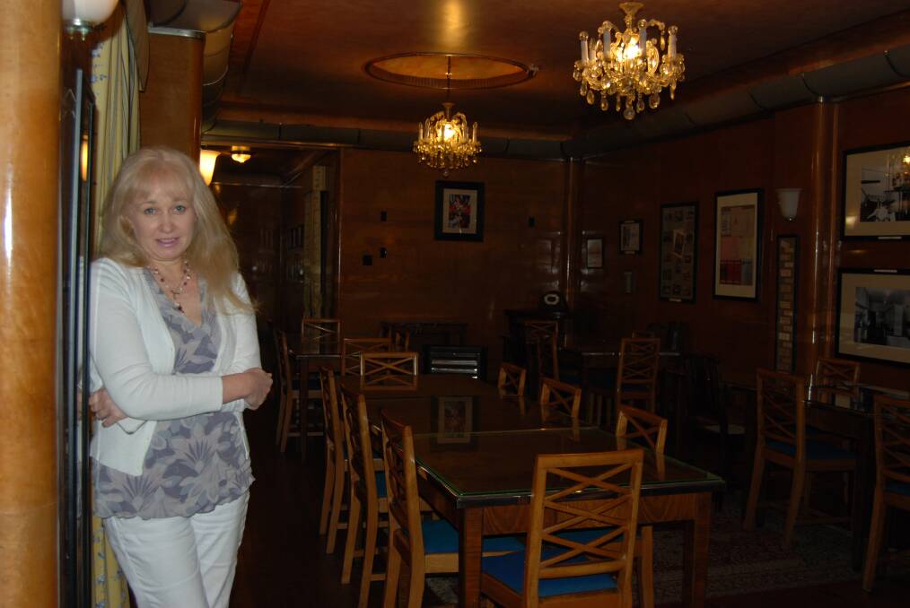 The cafe's owner Robyn Parker amid the art deco glory of the Paragon.