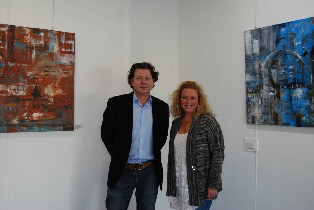 Paul Stride and artist Gabrielle Judd in front of some of her works in the new pop-up space in Blackheath.