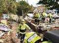 Rescue teams had been working around the clock, combing the ruins of a townhouse in Whalan. (Mark Evans/AAP PHOTOS)