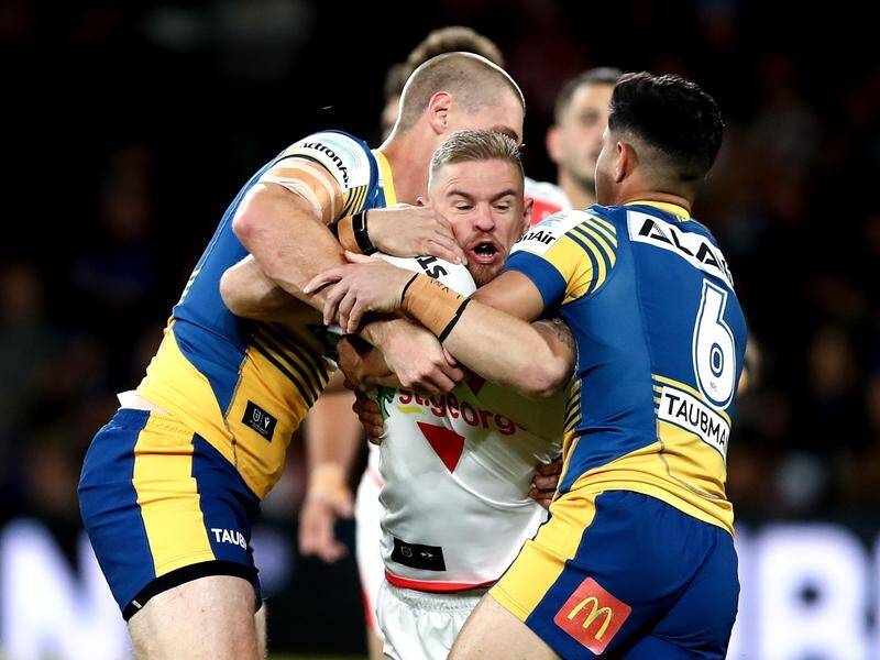 Safely held here, Matt Dufty (c) was the architect of the Dragons' upset NRL win over the Eels.