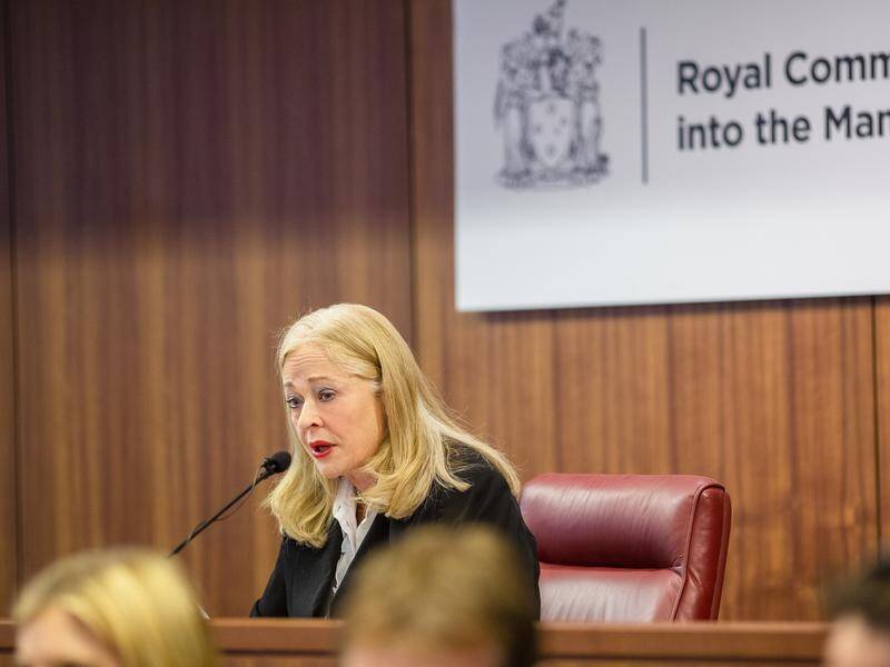 Royal commissioner Margaret McMurdo revealed a dead lawyer had also acted as a police informant.