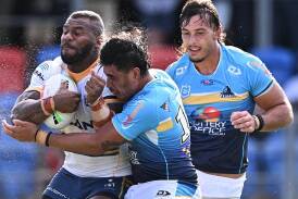 Gold Coast's Keenan Palasia (centre) and Tino Fa'asuamaleaui (right) are keys in a formidable pack. (Dave Hunt/AAP PHOTOS)