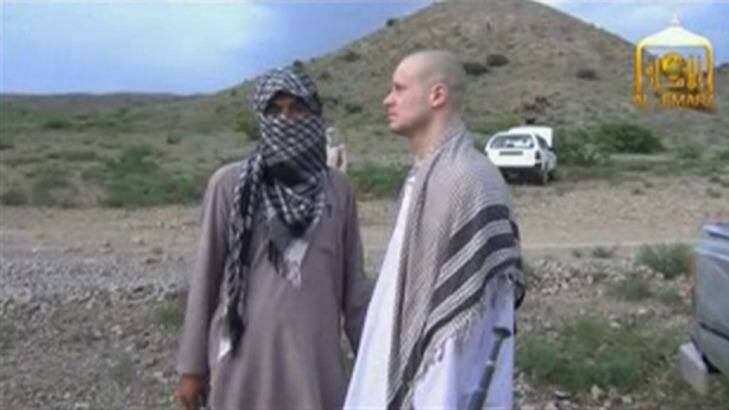 Bowe Bergdahl waits before being released at the Afghan border. Photo: Reuters/Al-Emara