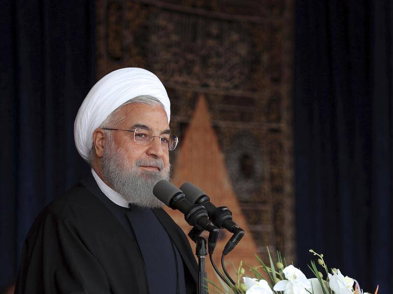 Iran's Hassan Rouhani says Donald Trump is a "tradesman" ill-equipped to grasp the nuclear deal.