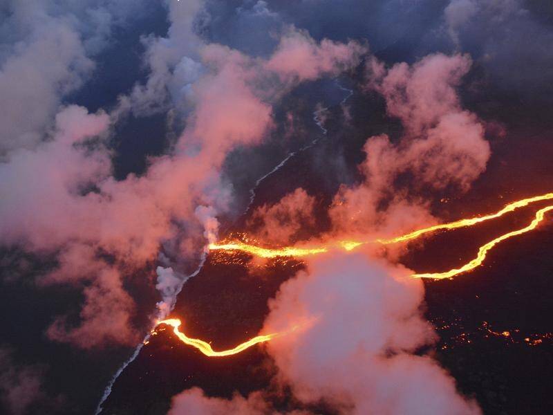 A lava flow from Hawaii's Kilauea volcano has split and is entering the ocean at two points.