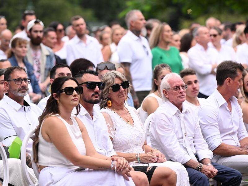 Luke Davies' has been honoured by family, friends and strangers at a memorial in Brisbane. (Darren England/AAP PHOTOS)