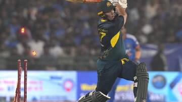 Ben McDermott gets bowled by India's Axar Patel in Australia's series-losing T20 loss in Raipur. (AP PHOTO)