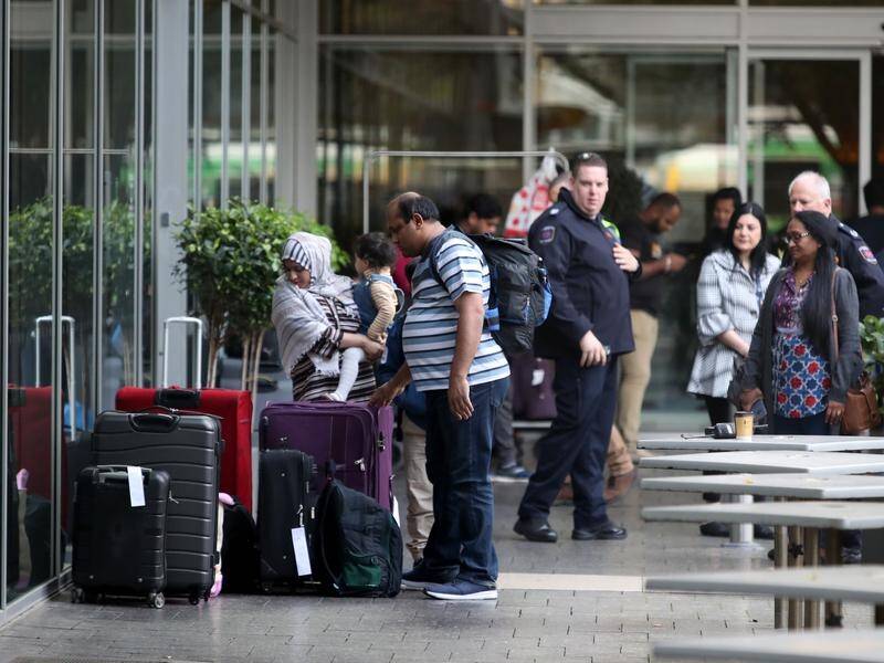 The government has cut the number of flights with returning Australians to pay for their quarantine.