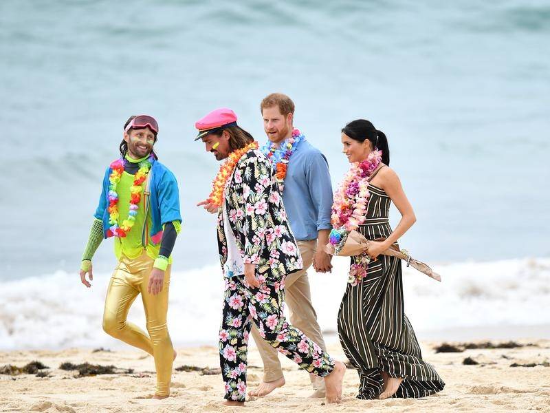 Meghan missed the fluro memo, but got the footwear right for their visit to Bondi Beach.