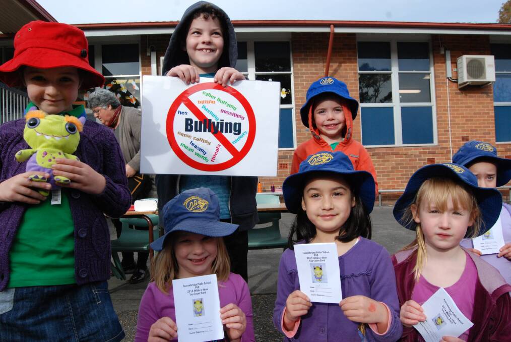 Faulconbridge public school students Kate E, Mitchell B, Jasper W (front) Sienna G, Marissa B and Abby D display anti-bullying posters and mascot 'Boz the Brave' during the school's annual walkathon fundraiser on June 13.