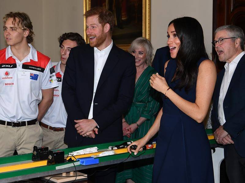 Prince Harry and Meghan were surprised during a race car demonstration in Melbourne.