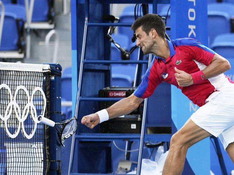 Novak Djokovic smashing his racquet in anger during his bronze medal defeat by Pablo Carreno Busta.