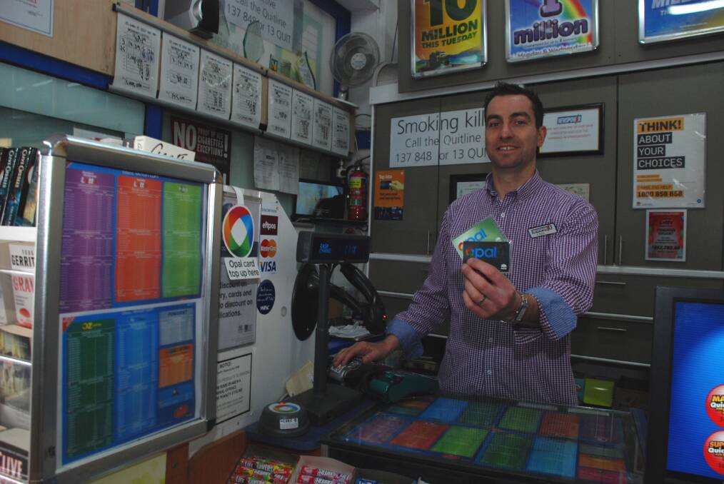 Chris Johnson with the Opal tickets for sale at Springwood Newsagency.