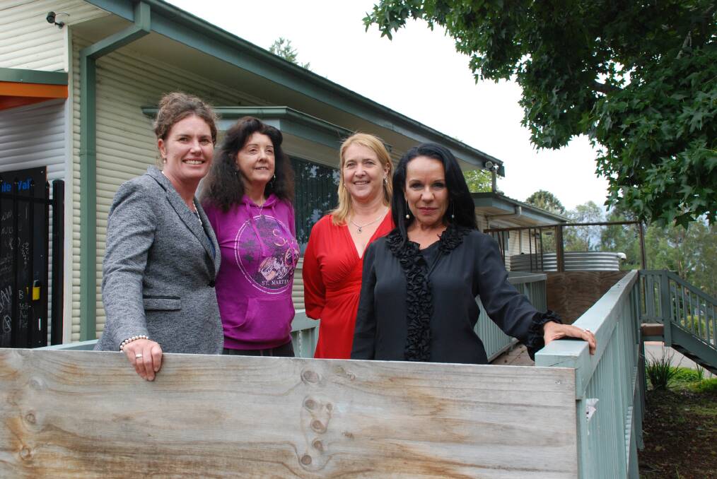 Labor candidate for Blue Mountains Trish Doyle, with Winmalee Neighbourhood Centre's manager Morna Colbran, centre management committee chair Kim Cowper and state Deputy Opposition Leader Linda Burney at the centre's dilapidated access ramp which Labor has committed to restoring if it wins the March election.
