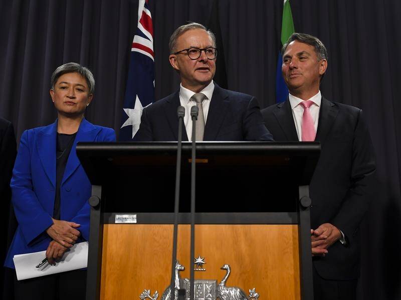Prime Minister Anthony Albanese (centre) will travel to Tokyo with Foreign Minister Penny Wong.