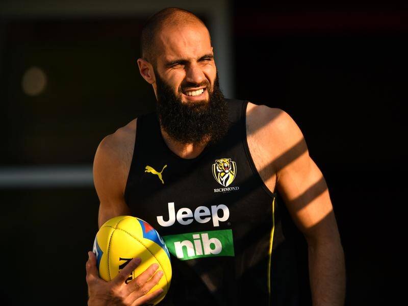 Bachar Houli will play a 10th season with Richmond after signing a new one-yeal contract extension.
