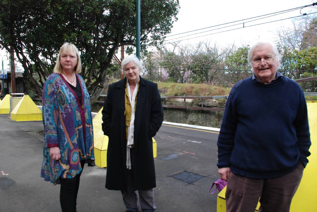 Adele Colman from Blackheath Chamber of Commerce, Linda McLaughlin from Blackheath Alliance and Leura architect Ian McMillan in front of the already-dug footings at Leura railway station. The shelters are still in the design stage.