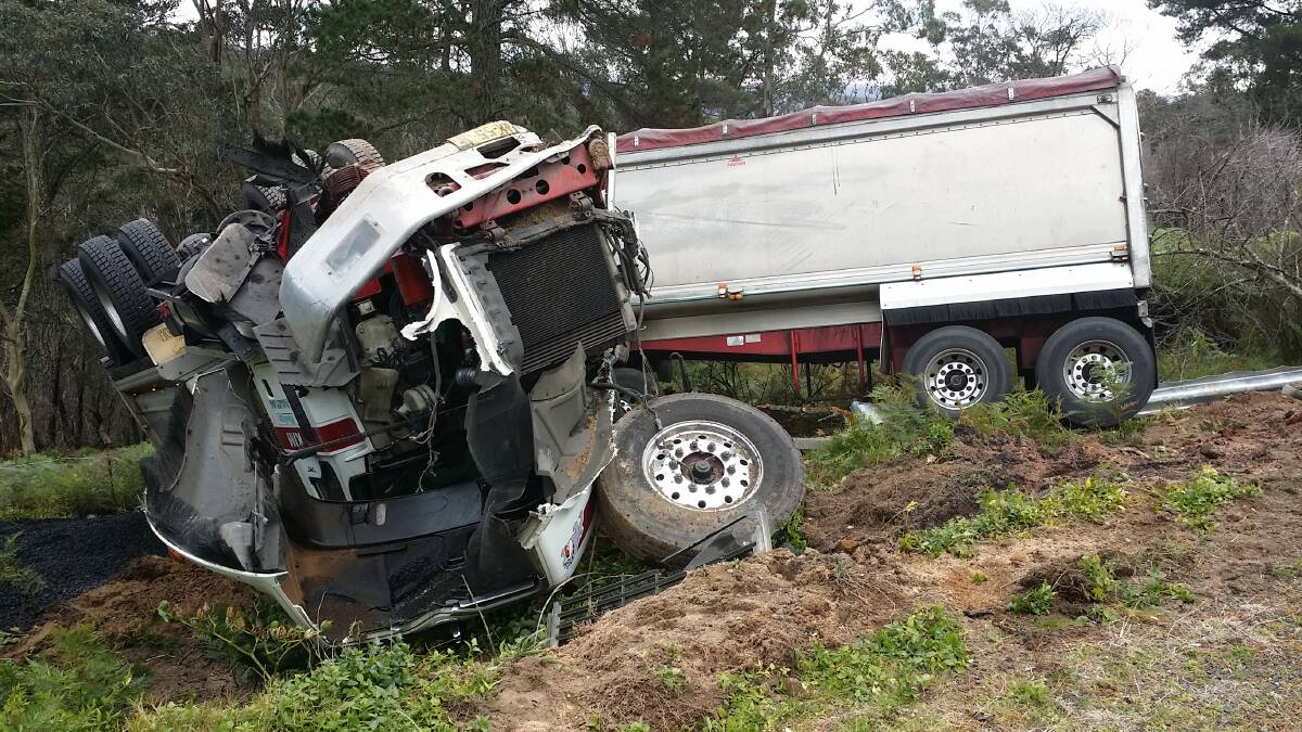A rolled tipper trailer truck on the side of the Darling Causeway following a collision with another heavy vehicle at about 10.35am on June 25. Photo: Top Notch.