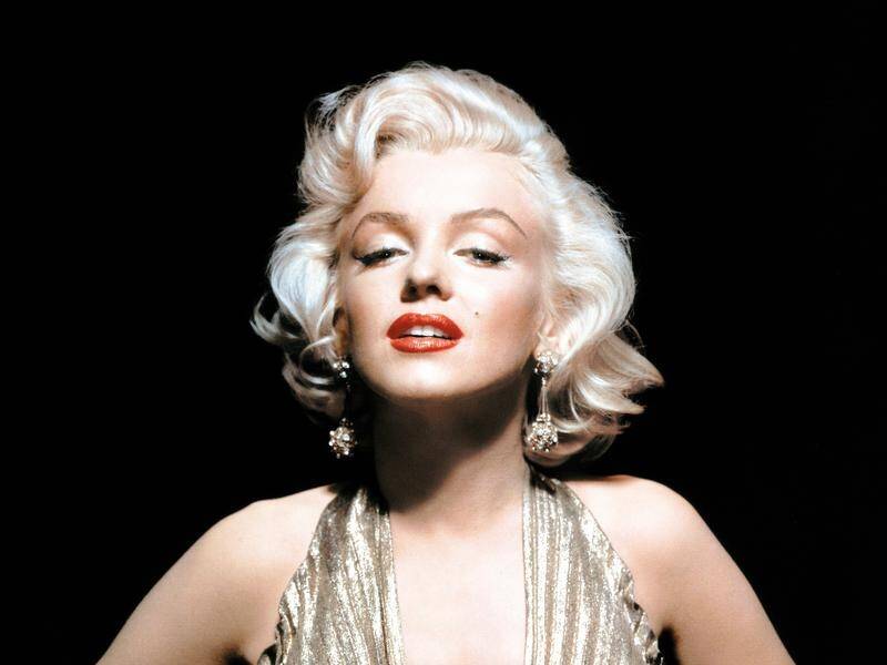 Dresses and outfits worn by film icon Marilyn Monroe have sold at auction for as much as $A405,000.