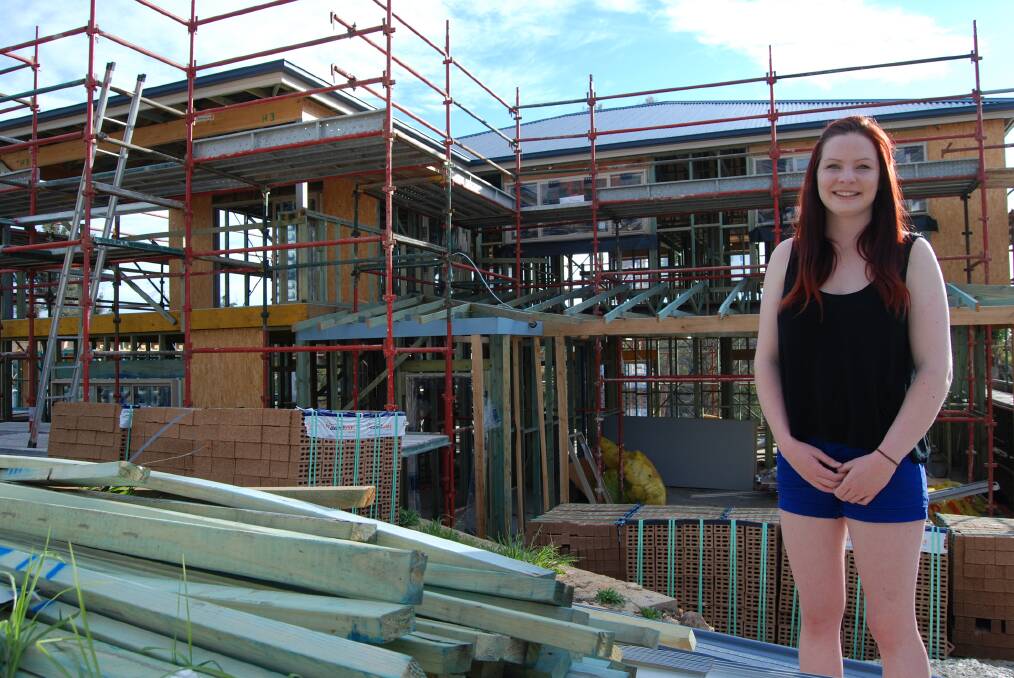 Emily Colman's childhood home, which was destroyed during last year's bushfires, is slowly being rebuilt and is expected to be completed by Christmas.