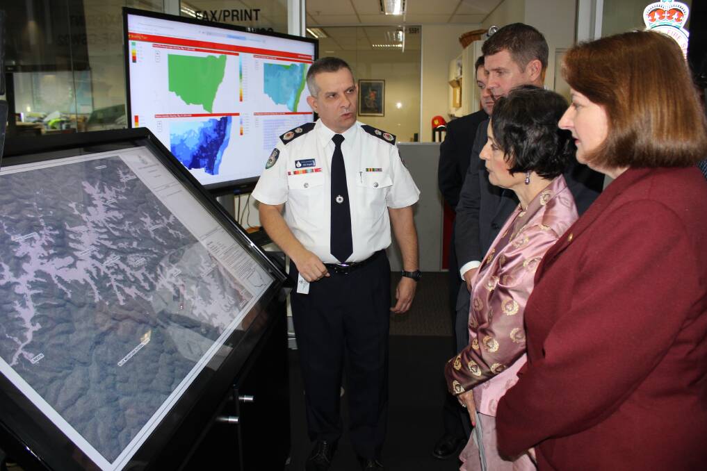 Rural Fire Service deputy commissioner Rob Rogers discusses the new land clearing laws with (from left) Penrith MP Stuart Ayres, NSW Premier Mike Baird, NSW?Planning Minister Pru Goward and Blue Mountains MP Roza Sage.