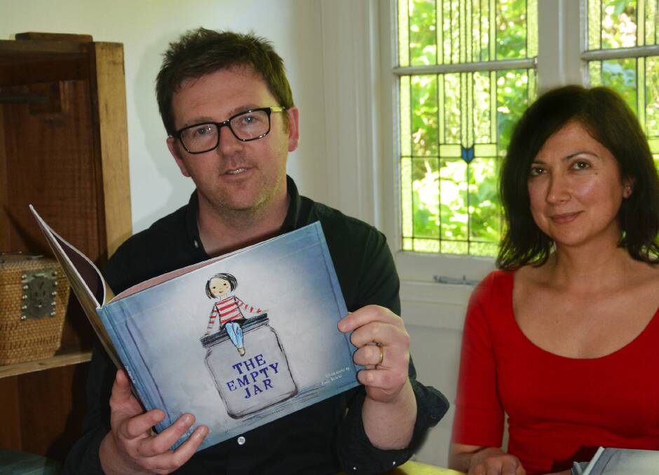Writer, Craig Billingham, and illustrator, Judith Martinez of Pablo Browne at their Katoomba home with their new children's book that's aimed at helping refugeechildren overcome the challenges of migration. Now through a crowd-funding initiative a resource kit could accompany it.