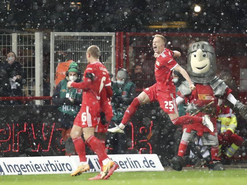 Timo Baumgartl jumps for joy after scoring Union Berlin's second and decisive goal against Leipzig.