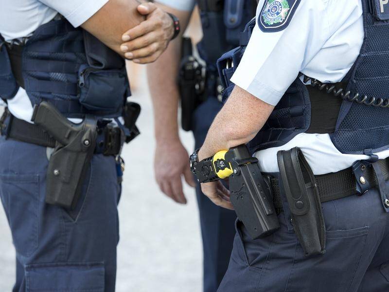 Police are hunting for the person who shot a man in the stomach at a business near Brisbane.