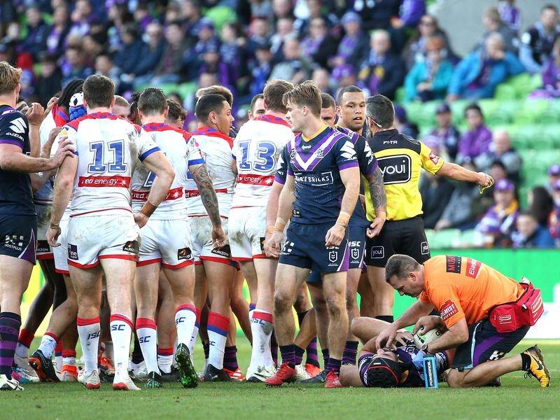 Storm's Jahrome Hughes (bottom right) was victim to a crusher tackle during NRL round 14.