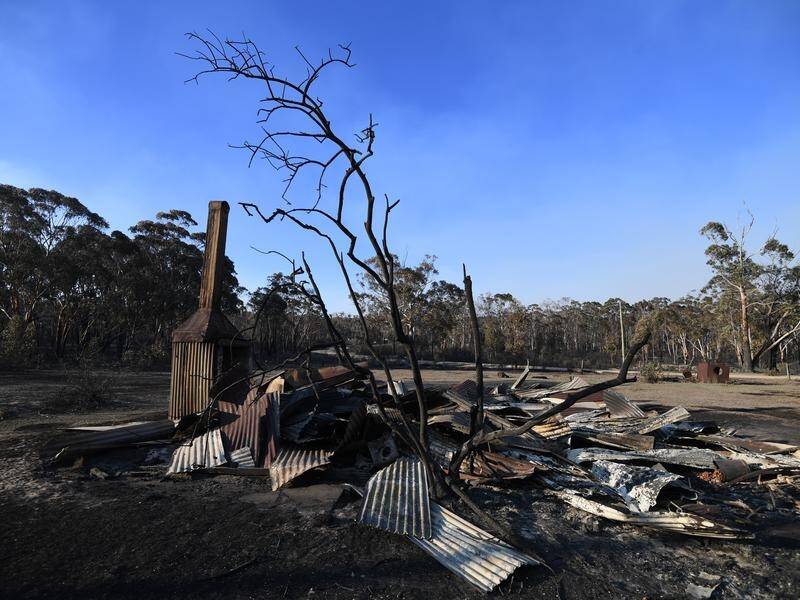The remains of a house destroyed by a bushfire are seen in Torrington, near Glen Innes.