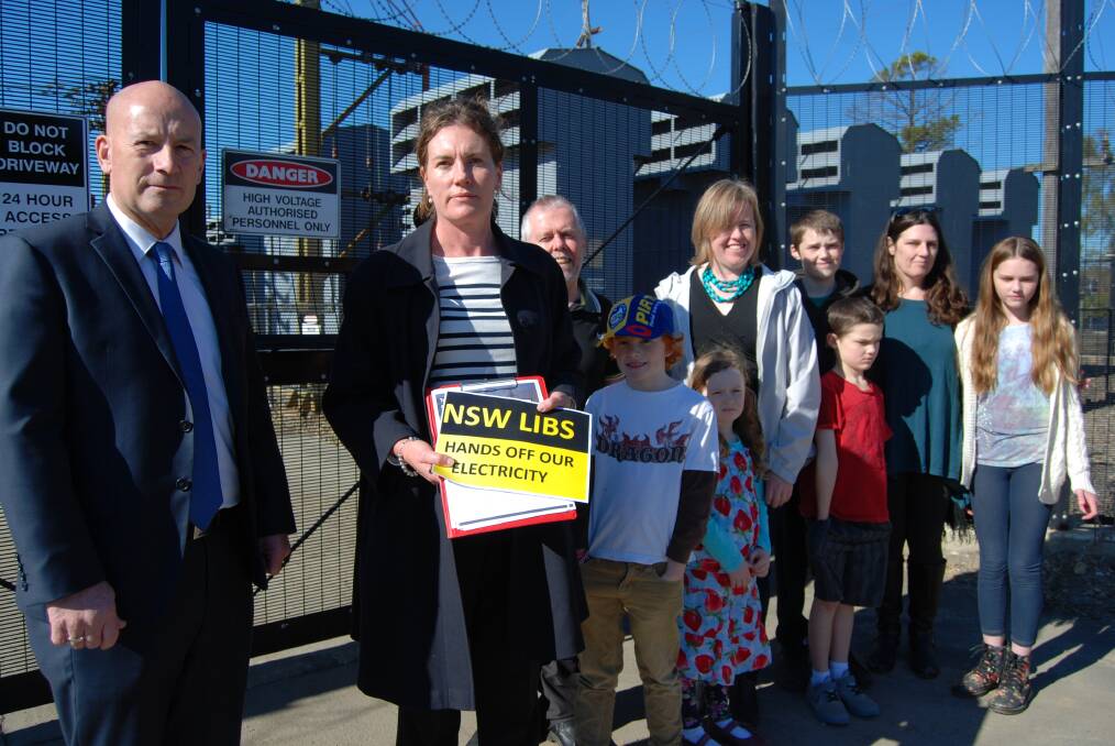 NSW Opposition Leader John Robertson and Blue Mountains Labor candidate Trish Doyle at the electricity sub-station in Blaxland with concerned residents.