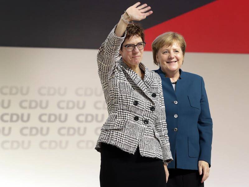 Newly-elected Annegret Kramp-Karrenbauer, left, with German Chancellor Angela Merkel.