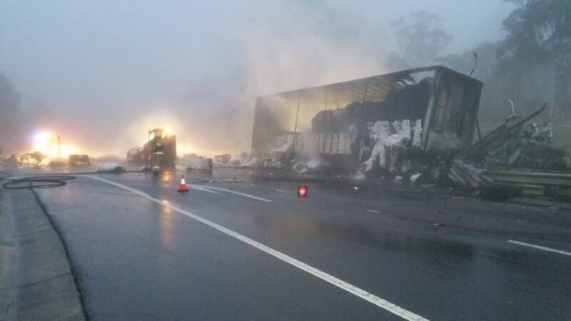 Bales of burning cotton surround the crashed truck they were in on the highway at Mt Boyce on June 5. Photo: Top Notch.