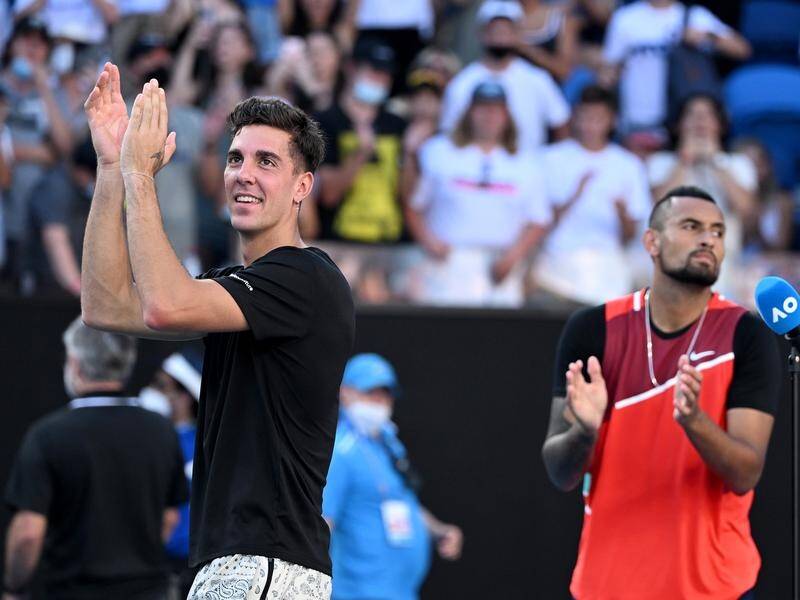 Thanasi Kokkinakis and Nick Kyrgios are through to the men's doubles semi-finals at Melbourne Park.