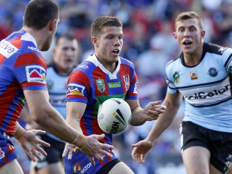 Newcastle NRL half Jack Cogger (C) has been backed as Mitchell Pearce's replacement against Manly.